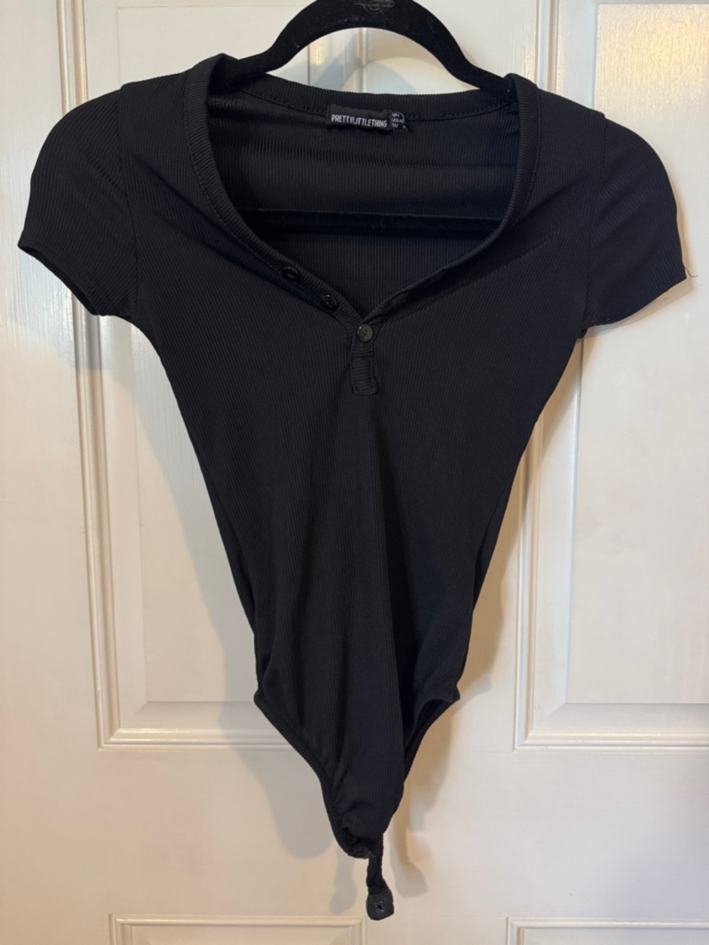PrettyLittleThing Black Ribbed Short Sleeve Henley Bodysuit